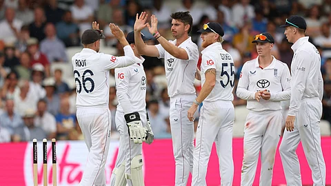 England players celebrate after taking a wicket