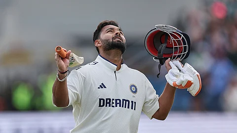 Rishabh Pant celebrates after scoring a century