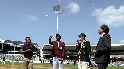 The coin toss was taken by the captain of the team. Along with the Aussie captain and commentators.