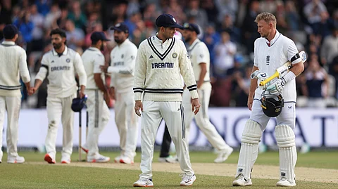 England's Joe Root, right, interacts with India's captain Shubman Gill after England won the first cricket test match