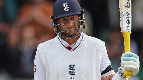 England's Joe Root celebrates after scoring fifty runs on day five of the first cricket test match between England and India at Headingley 