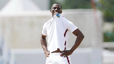 West Indies' bowler Shamar Joseph bites his jersey during day one of the first cricket Test match against Australia at Kensington Stadium in Bridgetown,