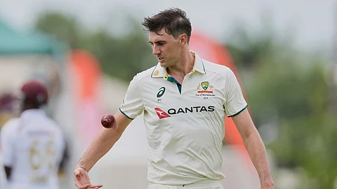Australia's captain Pat Cummins prepares to bowls against West Indies on day two of the first cricket Test match at Kensington Stadium 