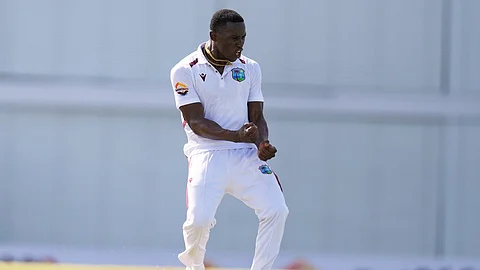 West Indies' Shamar Joseph celebrates after blowing Australia's Sam Konstas