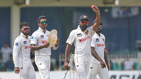 Sri Lanka's Prabath Jayasuriya acknowledges after taking five Bangladeshi wickets during the fourth day of the second cricket test match between Sri Lanka and Bangladesh in Colombo, 