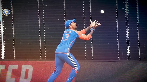 Suryakumar Yadav takes a catch.