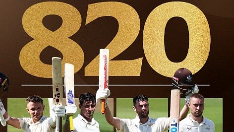 4 Surrey players who scored centuries.