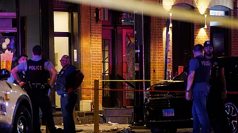 Officers work the scene of a shooting Wednesday,  