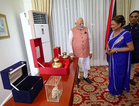 Modi gifts Kumbh Mela water to Trinidad and Tobago Prime Minister  
