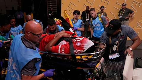 Bayern Munich's Jamal Musiala is taken off the field after an injury during the Club World Cup quarterfinal