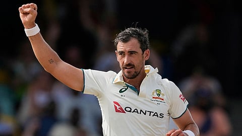 Australia's Mitchell Starc celebrates the dismissal of West Indies' Kraigg Brathwaite on day three of the first cricket