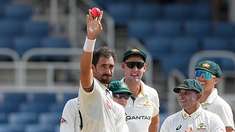 Australia's Mitchell Starc shows the ball after dismissing West Indies' Mikyle Louis to claim his 400th wicket in Test cricket 