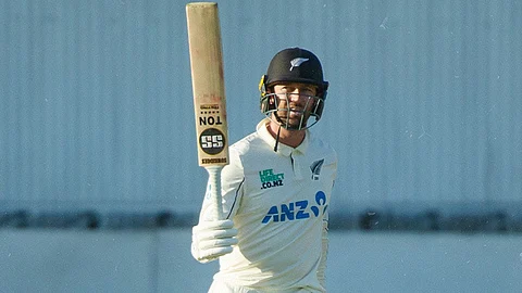 Devon Conway celebrates after scoring a half-century