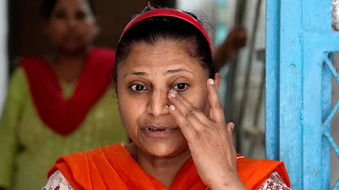 Wife of Asif Qureshi, cousin of actor Huma Qureshi, speaks to the media after he was stabbed to death following a dispute over parking, 