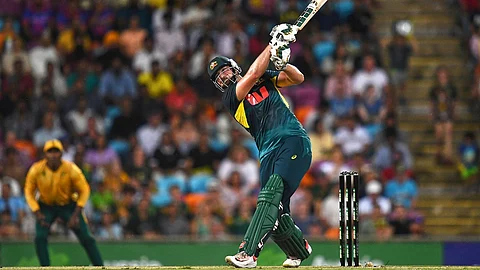 Tim David hits the ball for a six.