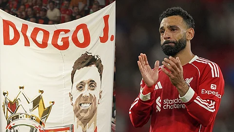 A banner depicting the late Liverpool player Diogo Jota is displayed on the stands, salah crying for him. 