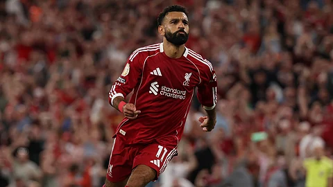 Mohamed Salah celebrates after scoring a goal...