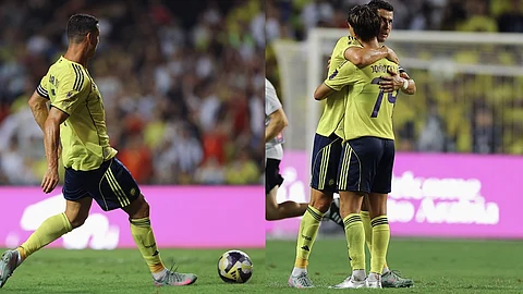 Al Nassr's Cristiano Ronaldo, left, passes the ball during the Saudi Super Cup semi finals. 