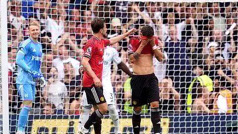 Manchester United's Bruno Fernandes reacts after missing a penalty during the English Premier League soccer.