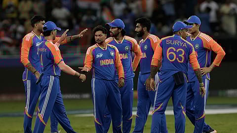Indian team players celebrate after taking a wicket