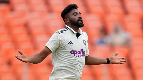 India's Mohammed Siraj celebrates the dismissal of West Indies' Alick Athanaze on the first day of the first Test cricket match.
