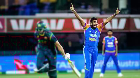India's Jasprit Bumrah right, reacts during the T20 cricket international between India and Australia in Hobart, Sunday.