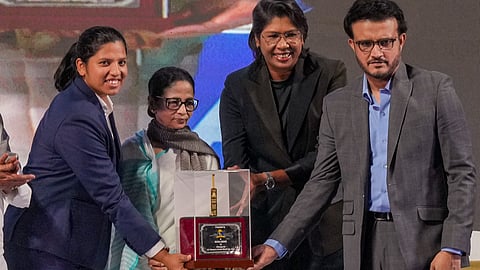 West Bengal Chief Minister Mamata Banerjee, Cricket Association of Bengal (CAB) President Sourav Ganguly and former cricketer Jhulan Goswami present a memento to Richa Ghosh, member of the Women's ODI World Cup 2025-winning Indian cricket team, during a felicitation ceremony.