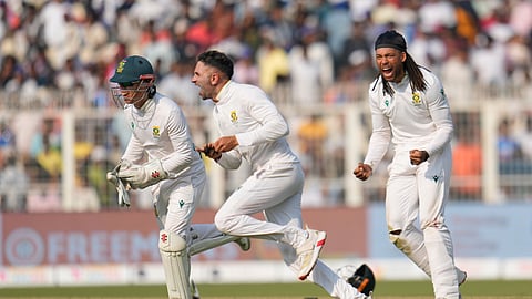 South Africa players celebrate their win on the third day of the first cricket test match against India in Kolkata, India,