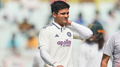 India's captain Shubman Gill reacts as he leaves the field after retired hurt on the second day of the first cricket test match in Kolkata.