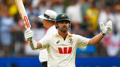 Travis Head celebrates after scoring a century
