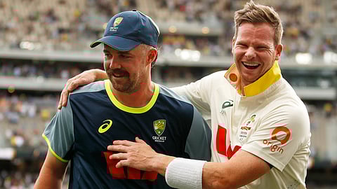 Australia's captain Steve Smith, right, and Travis Head celebrate after winning their first Ashes cricket test match against England in Perth.