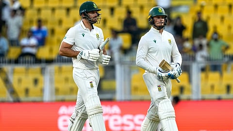South Africa's Aiden Markram and South Africa's Ryan Rickelton walk off the field at the end of the third day of the second cricket test match between India and South Africa in Guwahati