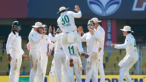 South Africa's players celebrate the dismissal of India's Washington Sundar on the fifth day of the second cricket test match between India and South Africa in Guwahati