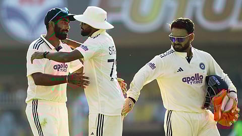 India's captain Rishab Pant, right, Mohammed Siraj, centre, and Jasprit Bumrah on the fourth day of the second cricket test match between India and South Africa in Guwahati,