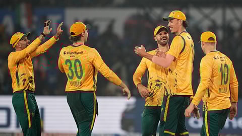 South Africa's players celebrates the wicket of India's Tilak Varma during the first T20 International cricket match between India and South Africa in Cuttack, India,