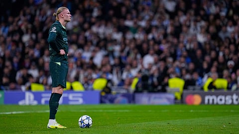 Manchester City's Erling Haaland stands before shooting a penalty kick to score his side's second goal during a Champions League opening phase soccer match between Real Madrid and Manchester City