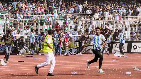 Fans of Argentine footballer Lionel Messi amid chaos during an event as part of his 'G.O.A.T. India Tour 2025', at Vivekananda Yuba Bharati Krirangan (VYBK).