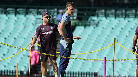 Australia's Todd Murphy looks at the pitch ahead of play on day one of the fifth and final Ashes cricket test between England and Australia in Sydney, Sunday