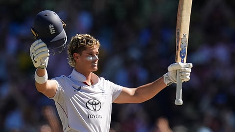 England's Jacob Bethell celebrates after scoring a century during play on day four of the fifth and final Ashes cricket test between England and Australia in Sydney