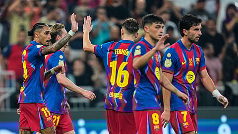 Barcelona players celebrate after scoring the fifth goal during the Spanish Super Cup semifinal soccer match against Athletic Club Bilbao at King Abdullah Sports City Stadium in Jeddah