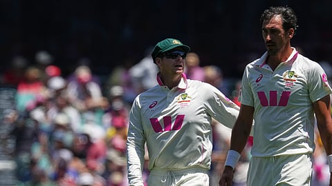 Australia captain Steve Smith, left, talks to teammate Mitchell Starc during play on day two of the fifth and final Ashes cricket test between England and Australia in Sydney