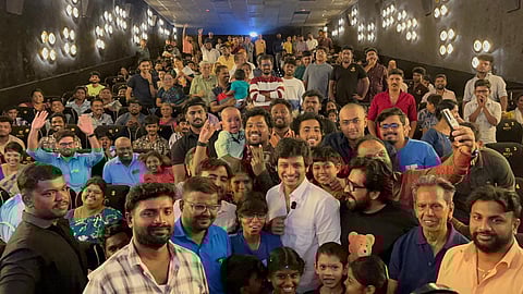 Actor Jiiva with fans at the movie theatre.