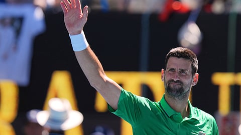 Novak Djokovic of Serbia waves after defeating Francesco Maestrelli of Italy in their second round match at the Australian Open tennis championship in Melbourne
