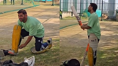 M.S. Dhoni preparing for batting practice.