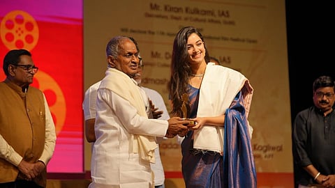 Bhagyashri Borse receiving an award from Ilaiyaraaja.