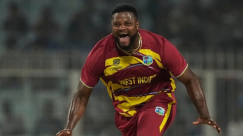 West Indies' Romario Shepherd celebrates the wicket of Scotland's Safyaan Sharif during the T20 World Cup cricket match between Scotland and West Indies in Kolkata, India,