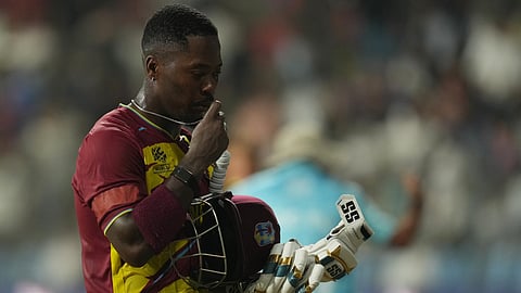 West Indies' Sherfane Rutherford walks back at the end of the first half of the T20 World Cup cricket match between England and West Indies in Mumbai, India, Wednesday, Feb. 11, 2026. (AP Photo/Rafiq Maqbool)