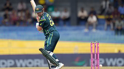 Australia's captain Travis Head bowled out by Zimbabwe's Bradley Evans during the T20 World Cup cricket match between Australia and Zimbabwe in Colombo, Sri Lanka, Friday, Feb. 13, 2026. (AP Photo/Eranga Jayawardena)