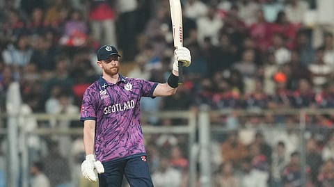 Michael Jones celebrates after scoring a half-century