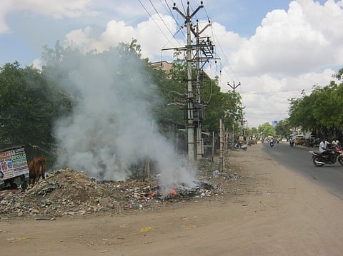 சிவகாசியில் மின்மாற்றி அருகே குப்பைக்கு வைக்கப்பட்ட தீ.